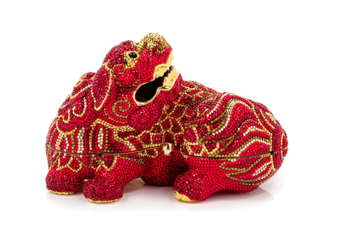 A Judith Leiber Limited Edition Red Foo Dog Minaudiere: A Judith Leiber Limited Edition Red Foo Dog Minaudiere goldtone hardware, red and gold crystals, gold interior lining, a push button closure with a drop-in or removable chain shoulder strap. Together