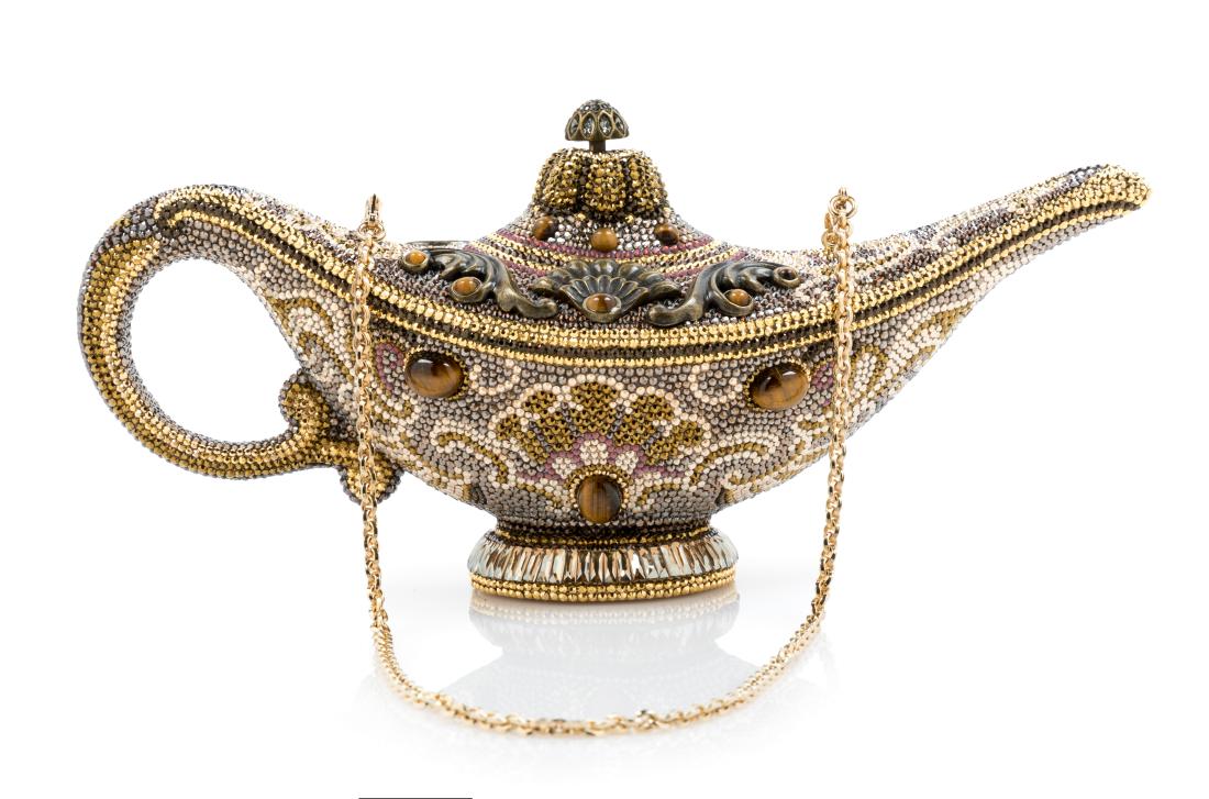 Judith Leiber Genie Lamp Minaudiere: Judith Leiber Genie Lamp Minaudiere goldtone with gold lining. Stamped: Judith Leiber, New York, Collector's Edition. Together with dustbag and box. Estimate $300-400 Overall excellent condition. No a