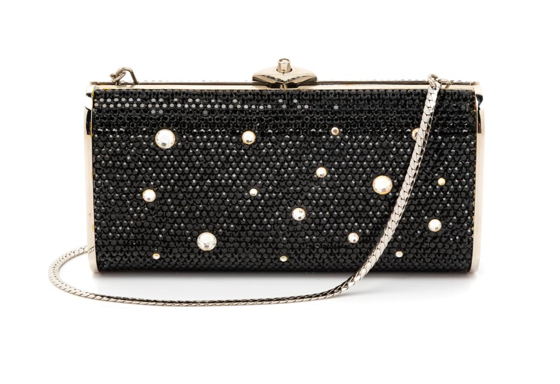 * Judith Leiber Jeweled Clutch: * Judith Leiber Crystal Clutch Rectangular clutch covered with black crystals with larger rhinestone of clear paste. Silvertone frame, clasp and strap. Silver leather lining. Label: Judith Leiber © E