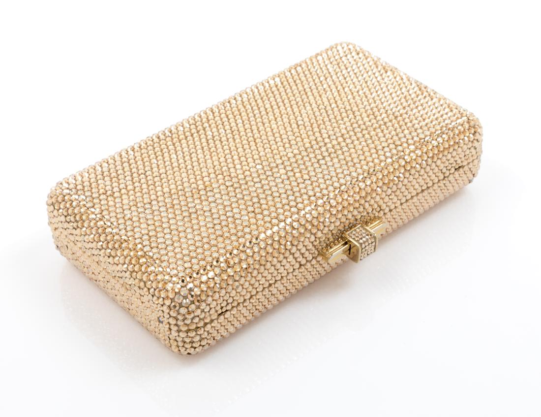 Judith Leiber Goldtone Rectangle Minaudiere: Judith Leiber Goldtone Rectangle Minaudiere, goldtone crystals with a gold interior, top slide lock closure. Stamp: Judith Leiber, New York. Established in 1963. Estimate $200-300