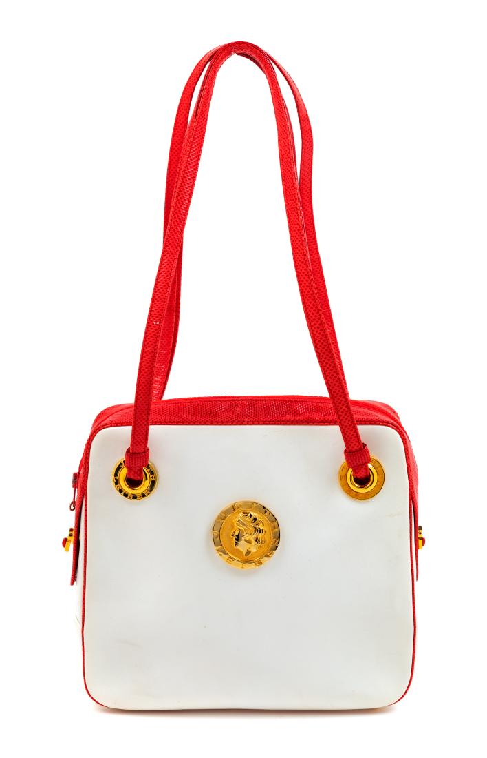 Judith Leiber Red and White Bag: Judith Leiber Red and White Bag The bag is in good condition with minor marks in the white leather on the front and back. The zipper pull has broken from the zipper and is in the inside of the bag. Me