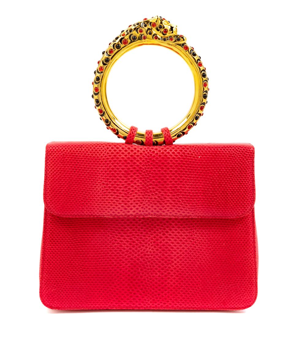 * Judith Leiber Red Skin Purse: * Judith Leiber Red Skin Purse, goldtone hardware, circular panther-form handle studded with small black and red stones. interior red lining with an interior back slip pocket, two compartments; one wi