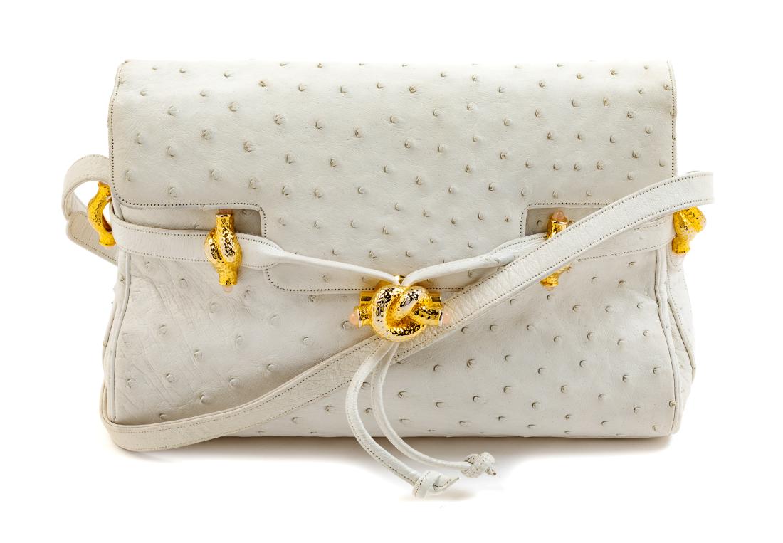 Judith Leiber White Ostrich Bag: Judith Leiber White Ostrich Bag Estimate $100-150 Measurements: L 10.25", W 3.5", H 7". Strap drop: 16.5" (with buckles to adjust this length). The bag is in good condition with a good condition linin