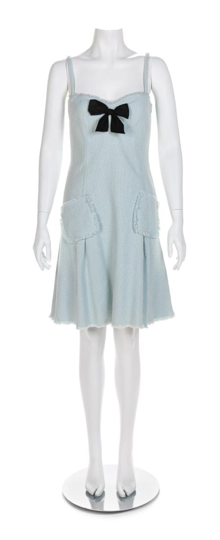 Moschino Cheap and Chic Dress with Black Bow,: Moschino Cheap and Chic Dress with Black Bow, 1990-2000s Estimate $150-200 Size label: 8 The stated overall condition of the lot is based on the assumption that the wear is consistent with age and use