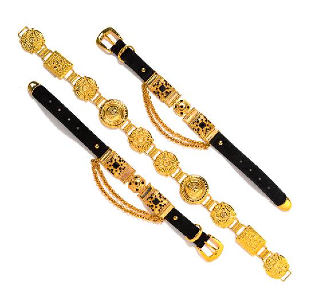 Medusa Medallion Belt and Two Decorative Chokers, 1990s: Medusa Medallion Belt and Two Decorative Chokers, 1990s Goldtone Medusa medallions with decorative circle and square link belt. Black chokers with decorative goldtone squares and center circle with bl