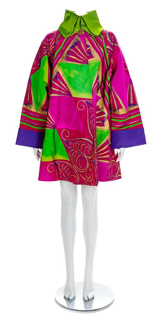 Gianni Versace Printed Swing Coat, 1990s No size label: Gianni Versace Printed Swing Coat, 1990s Fuschia, green, purple and gold printed silk coat with a wide sweeping hem and wide sleeves. Sleeves are cuffed with a top-stitched purple silk and the collar 