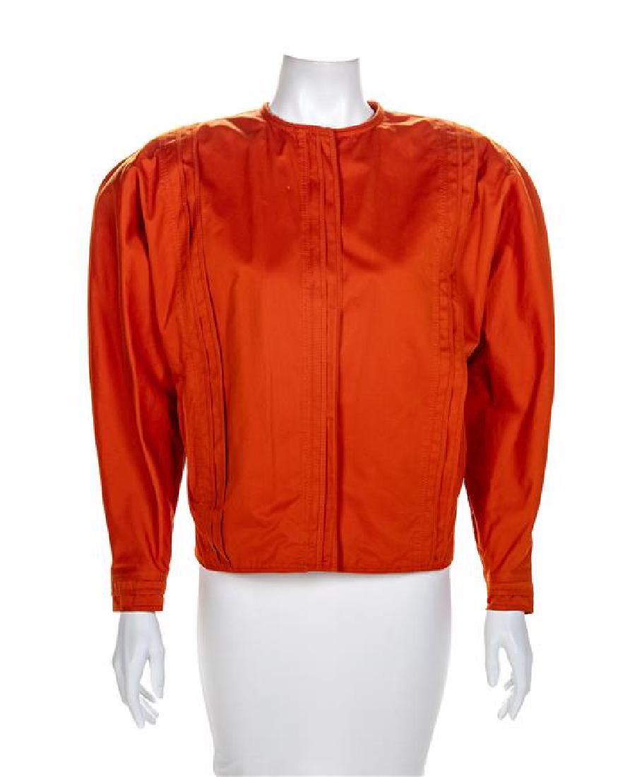 Gianni Versace Orange Cotton Coat, 1980s Size label: 12: Gianni Versace Orange Cotton Coat, 1980s Collarless with vertical top stitch details on front and back, two front pockets, dolman sleeves, unlined with large shoulder pads with a front orange zip clos