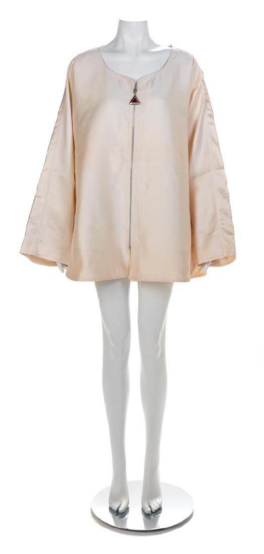 Gianni Versace Oversized White Silk Jacket, 1990s No: Gianni Versace Oversized White Silk Jacket, 1990s White silk jacket with scoop neckline, wide sleeves and hip pockets. The jacket is lined in white silk and closes down the center front with a silvert