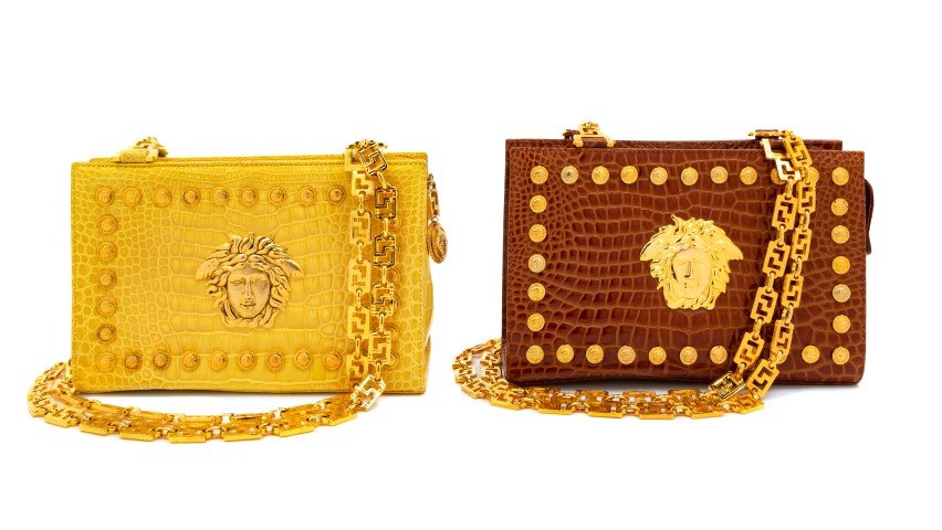 Two Gianni Versace Couture Handbags, 1990s: Two Gianni Versace Couture Handbags,1990sYellow faux alligator, goldtone hardware, mini medusa medallion border and a large center medusa, one interior zip pocket, top zip closure with a greco chain s
