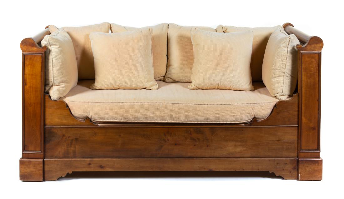 A Louis Philippe Fruitwood Daybed Height 36 1/2 x width: A Louis Philippe Fruitwood Daybed 19th century having a later cushion and pillows. Height 36 1/2 x width 75 x depth 29 3/4 inches.