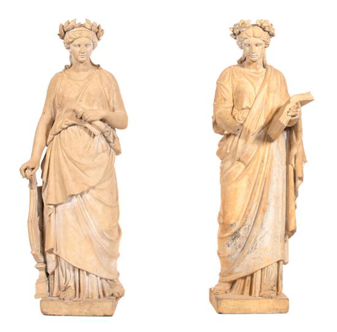 A Pair of Classical Style Statues Depicting Grecian: A Pair of Classical Style Statues Depicting Grecian Muses after the antique/ 20th century one depicting Erato holding a scroll of music and cithara, the other depicting Clio holding an open book, moun