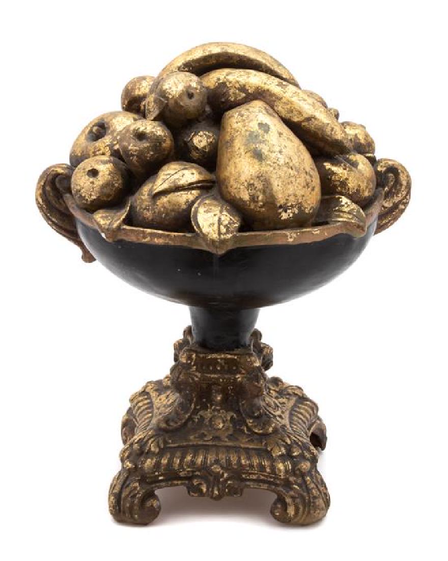 An Italian Ebonized and Gilt Fruit Bowl: An Italian Ebonized and Gilt Fruit Bowl 20th century Height 16 inches. Estimate $80-120 Property from the Estate of Ian MacKay Kean, 2 Via Mizner, Palm Beach, FL