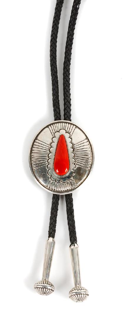 Jacob and Irene Livingston Height 3 x width 2 1/2: Jacob and Irene Livingston (dine-zuni, 20th century) silver and coral bolo stamped J.I. Livingston Height 3 x width 2 1/2 inches Estimate $500-700