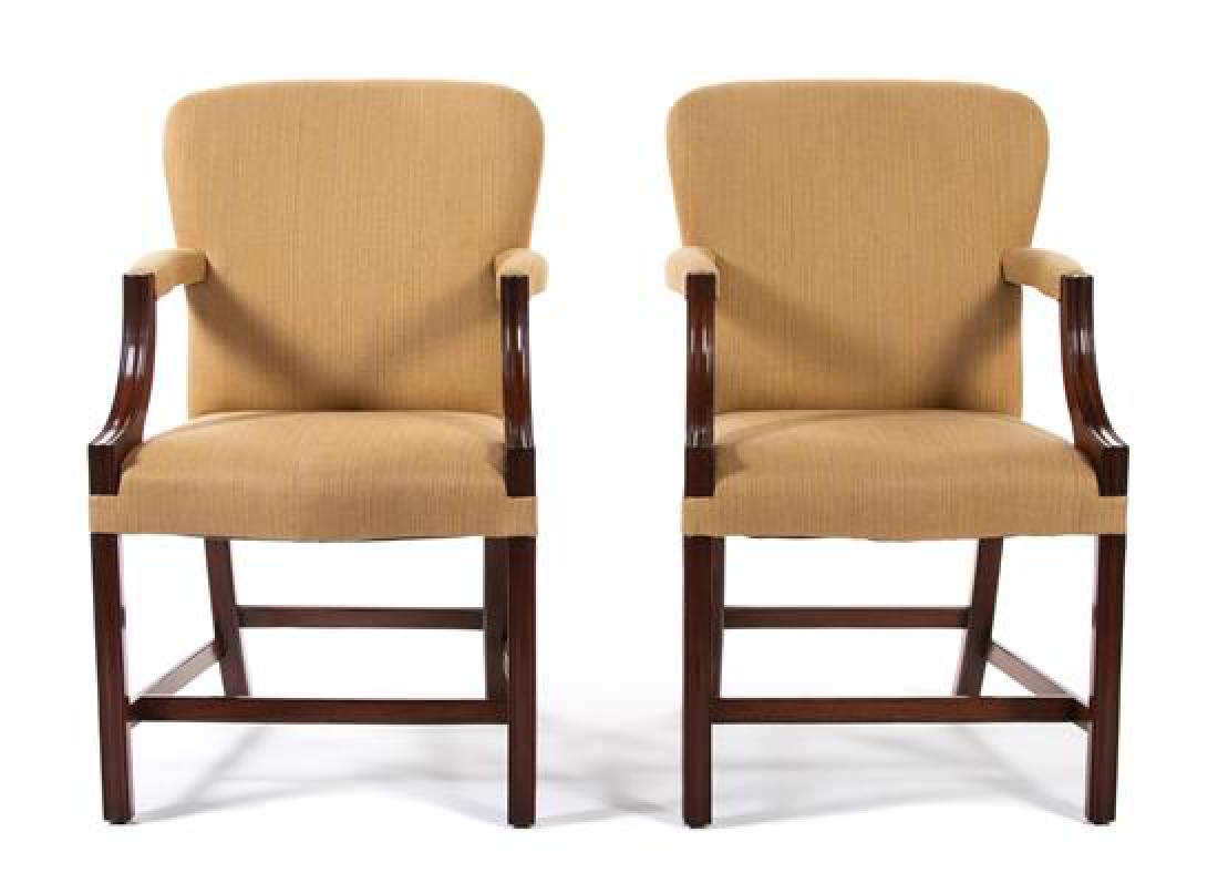 A Pair of George III Style Upholstered Mahogany: A Pair of George III Style Upholstered Mahogany Armchairs ROSE TARLOW/MELROSE HOUSE, LOS ANGELES Each with rounded and upholstered back over padded arms on molded downswept supports, the serpentine-fr