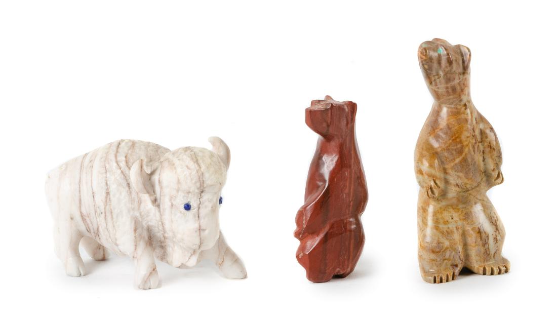 Three Large Southwestern Carved Stone Fetishes Height: Three Large Southwestern Carved Stone Fetishes Height of largest 3 1/2 inches two depicting standing bears and one a buffalo
