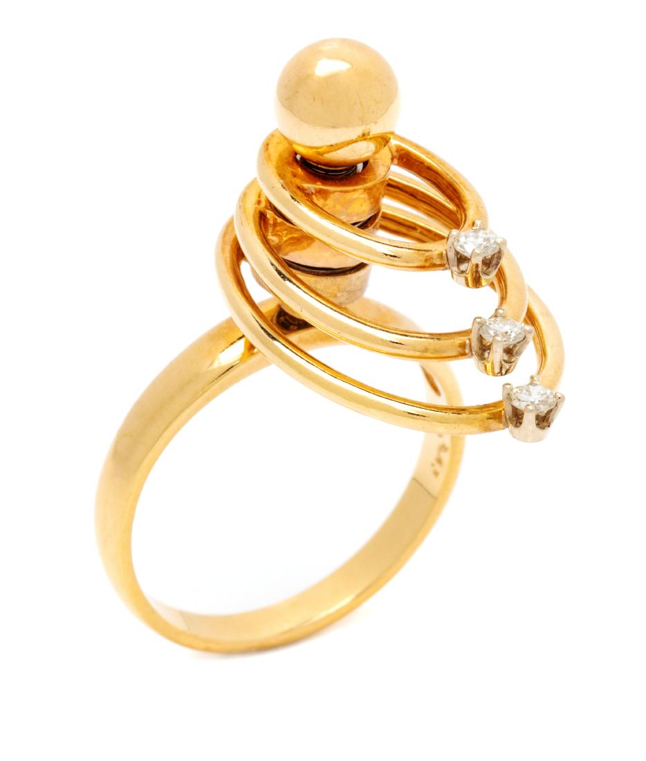 A 14 Karat Yellow Gold and Diamond 'Swinger' Ring, (1 of 2)