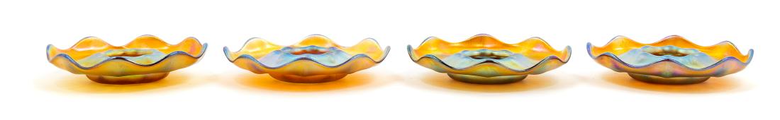 Tiffany Studios, American, Early 20th Century, Set of: Set of Four Candle Holders Tiffany Studios, American, Early 20th Century, Favrile glass, etched L.C.T. 1959 to underside, Diameter 4 inches each