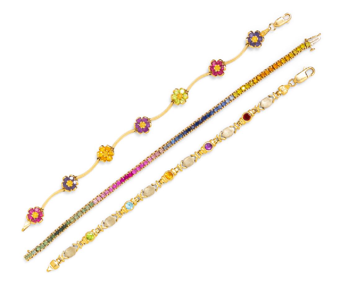 *A Collection of 14 Karat Yellow Gold and Multigem: consisting of a bracelet containing numerous rectangular mixed cut gemstones in graduating colors, a bracelet containing alternating brushed white gold links with five round mixed cut gemstones of var