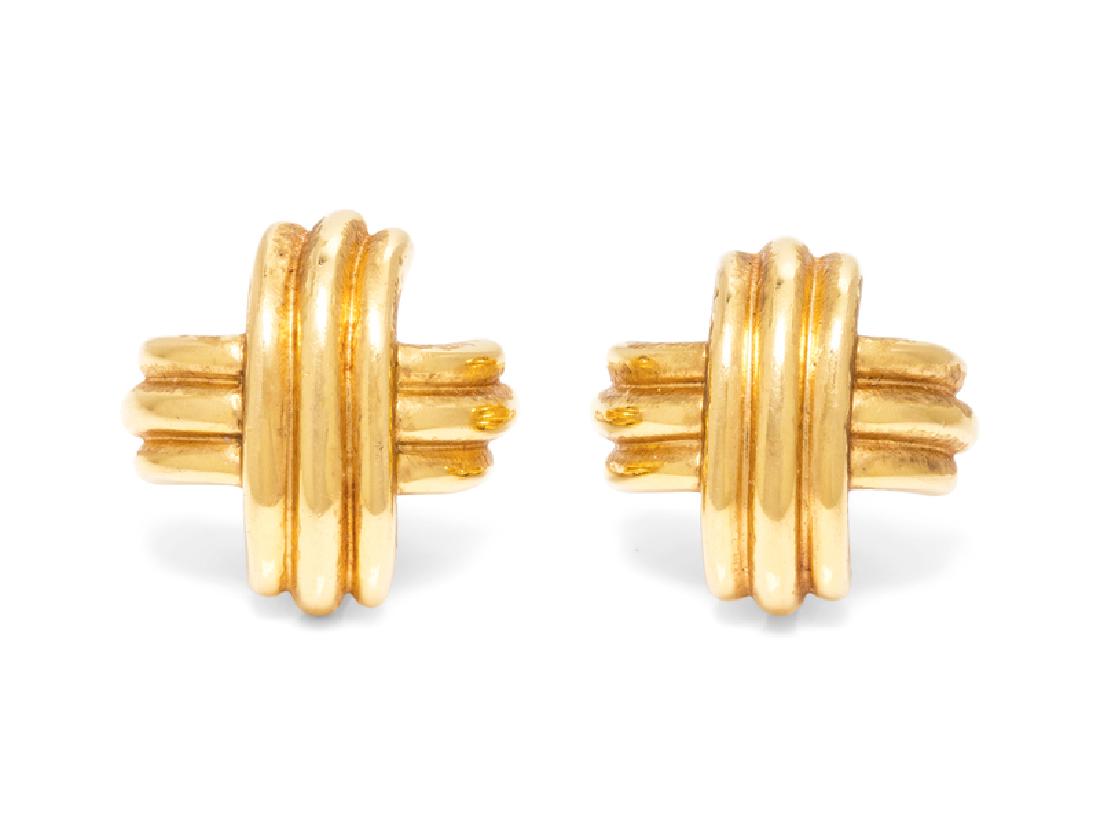 A Pair of 18 Karat Yellow Gold Criss-Cross Earclips,: measuring approximately 25.00 x 25.00 mm. Stamp: T & CO. 750. 14.60 dwts. Provenance: Property from the Estate of Jacqueline Macomber, Fox Point, Wisconsin