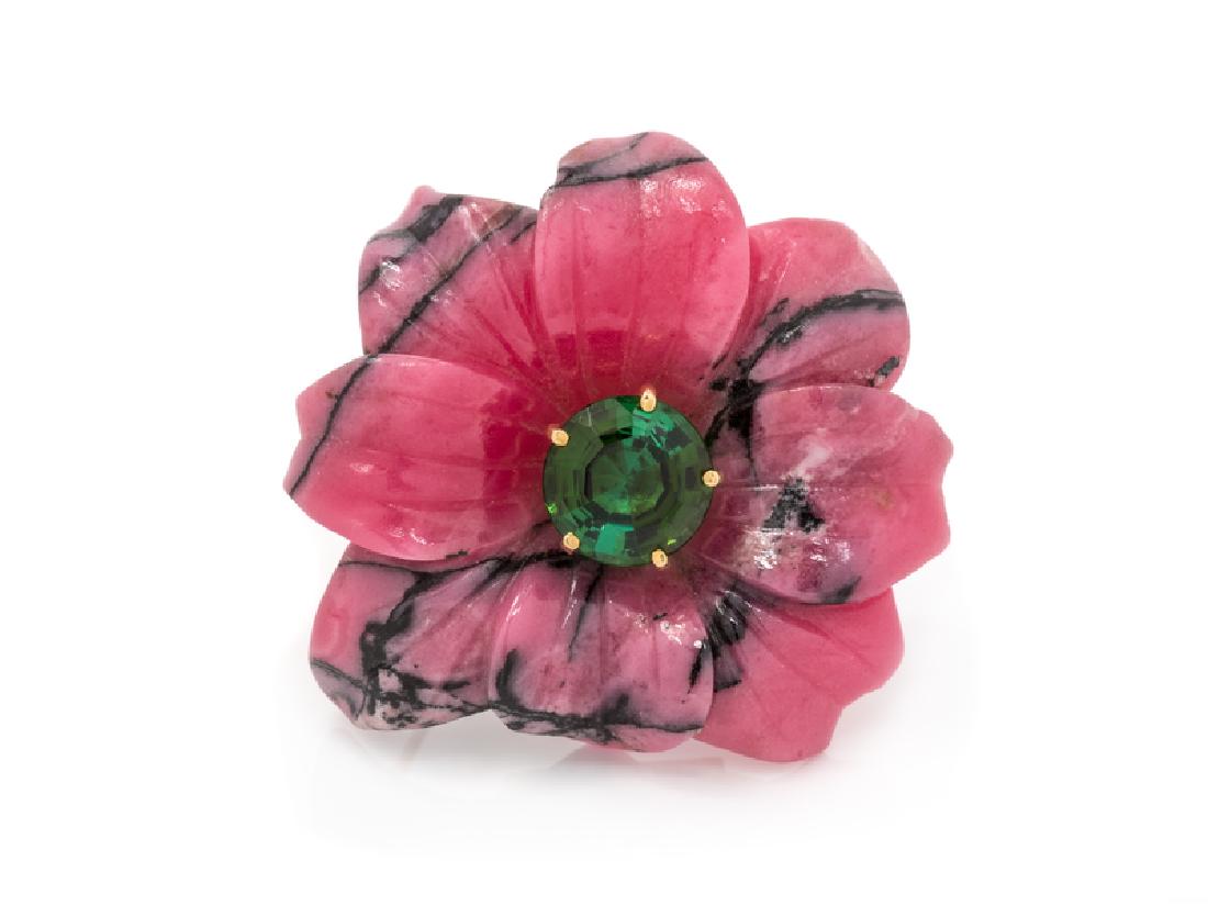 An 18 Karat Yellow Gold, Rhodonite and Green Tourmaline: consisting of a carved rhodonite flower, the center surmounted with a round step cut green tourmaline weighing approximately 3.65 carats. Stamp: 1983 TIFFANY&CO. 18K PALOMA PICASSO. 13.20 dwts.