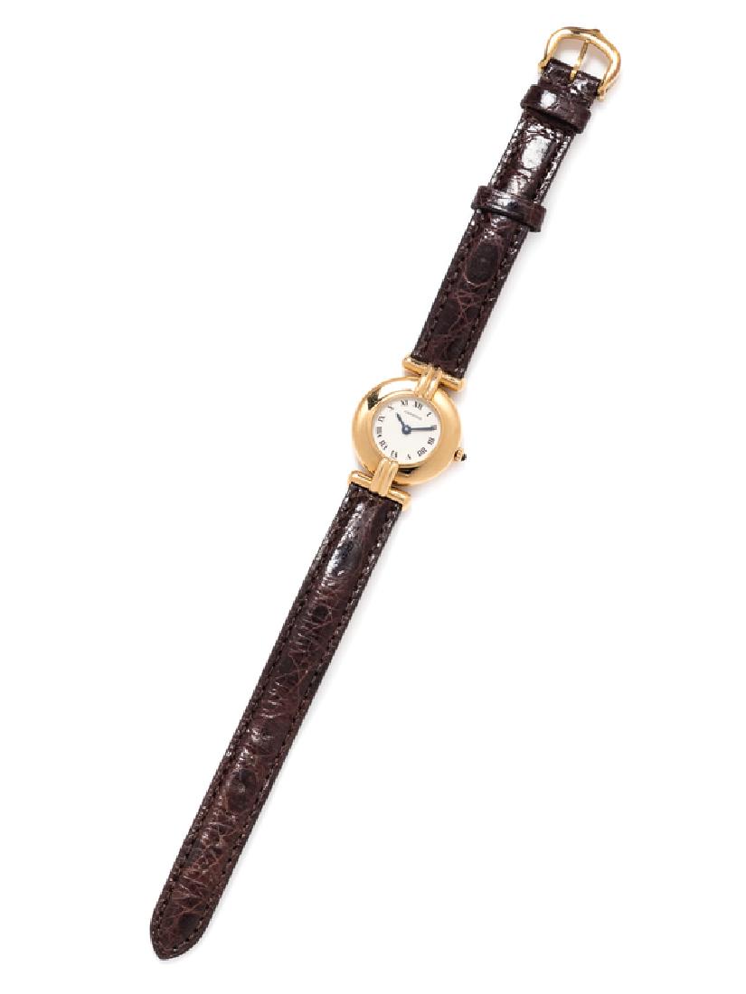 An 18 Karat Yellow Gold 'Rivoli' Wristwatch, Cartier,: 23.00 mm case diameter, cream dial signed Cartier with secret signature at 10 o'clock, blued steel sword hands, snap on case back, quartz movement, brown crocodile strap, gold tone tang buckle. Case b