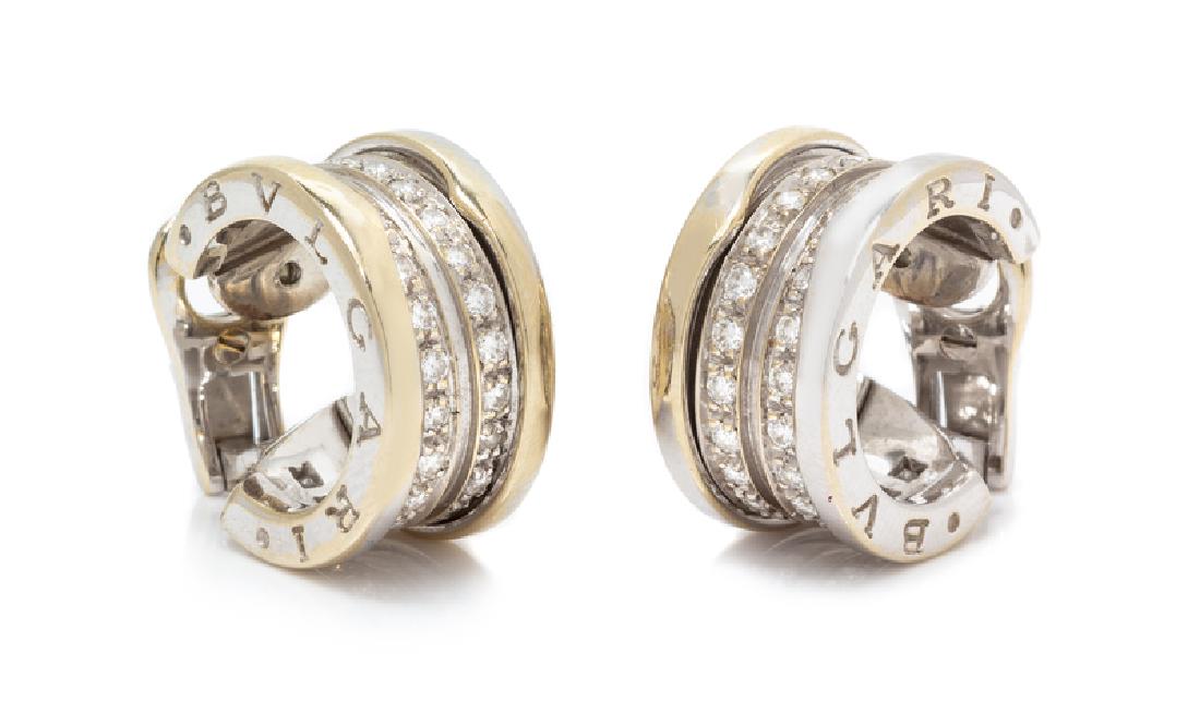 A Pair of 18 Karat White Gold and Diamond 'B.Zero1': containing 54 round brilliant cut diamonds weighing approximately 0.80 carat total. Stamp: (BB maker's mark) BVLGARI (hallmark 750). Accompanied by a box signed BVLGARI. 9.40 dwts.