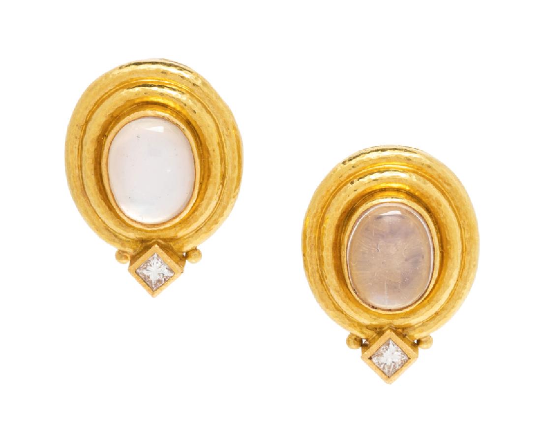 A Pair of 18 Karat Yellow Gold, Moonstone and Diamond: containing two oval shape cabochon cut moonstones measuring approximately 10.40 x 8.50 mm and two princess cut diamonds weighing approximately 0.40 carat total, folding posts with clip backs. Stamp: (
