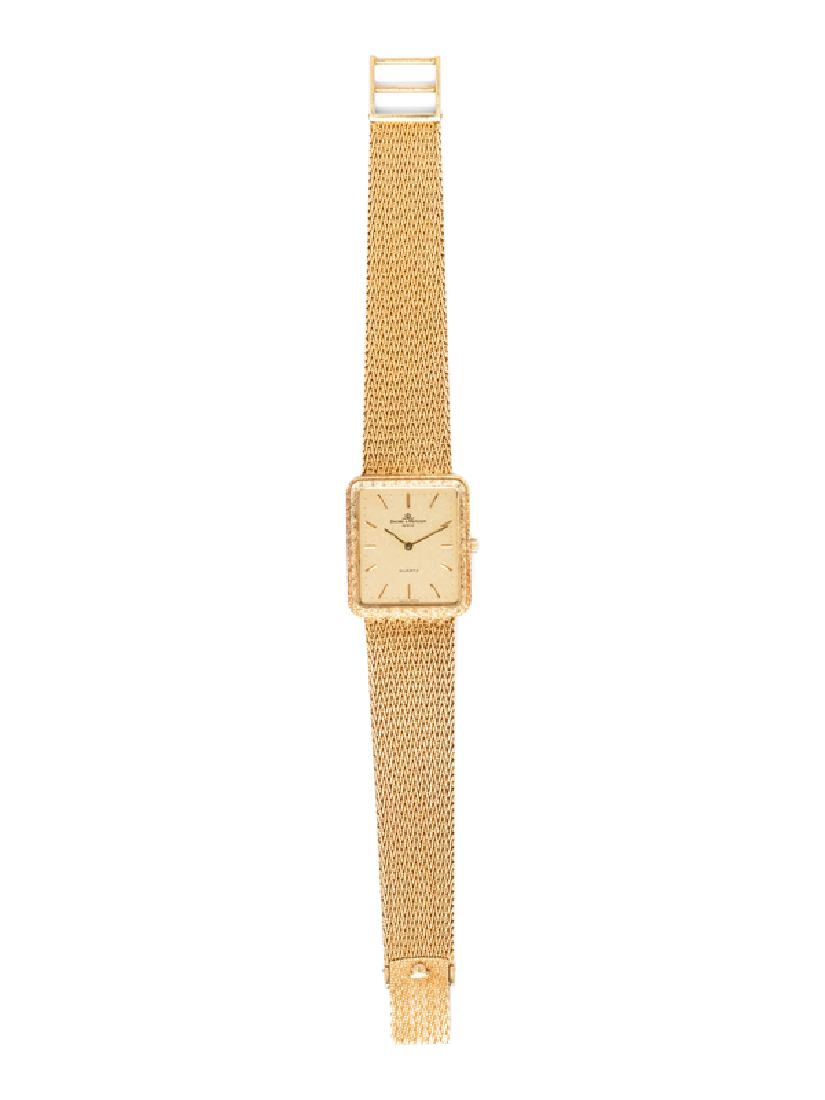 A 14 Karat Yellow Gold Wristwatch, Baume & Mercier,: 28.00 x 24.00 mm case dimensions, champagne dial signed BAUME & MERCIER, applied gold baton numerals, gold pencil hands, textured gold bezel, snap on case back, six jewel movement, textured woven mesh