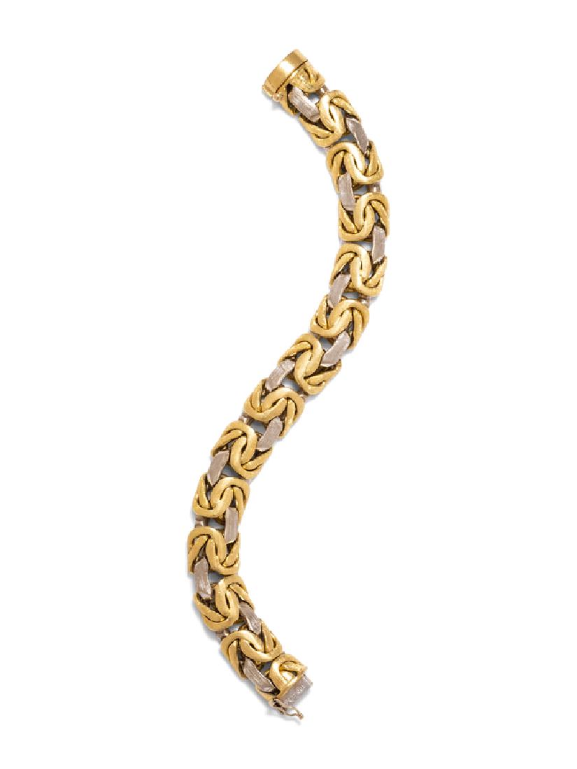 An 18 Karat Bicolor Gold Bracelet,: consisting of a domed Byzantine link chain with brushed finish. Stamp: DBGM 750. 66.55 dwts.
