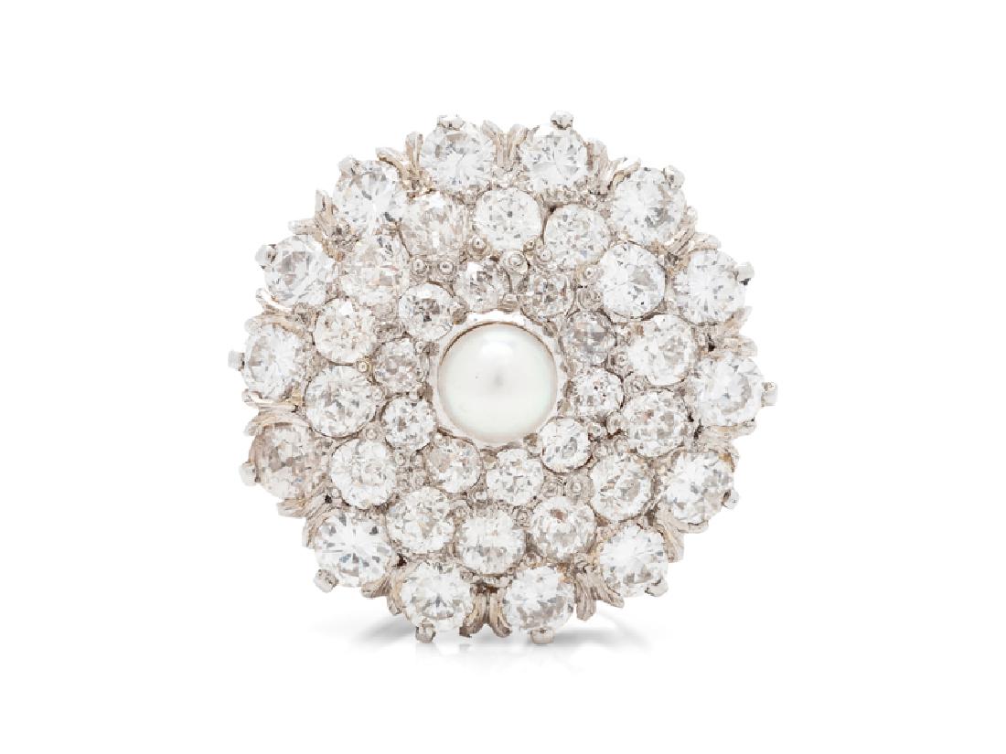 A Single Edwardian Platinum Topped Yellow Gold, Diamond: containing 38 old mine and old European cut diamonds weighing approximately 1.30 carat, total and one pearl (origin not tested) measuring approximately 3.78 mm in diameter. 2.90 dwts.