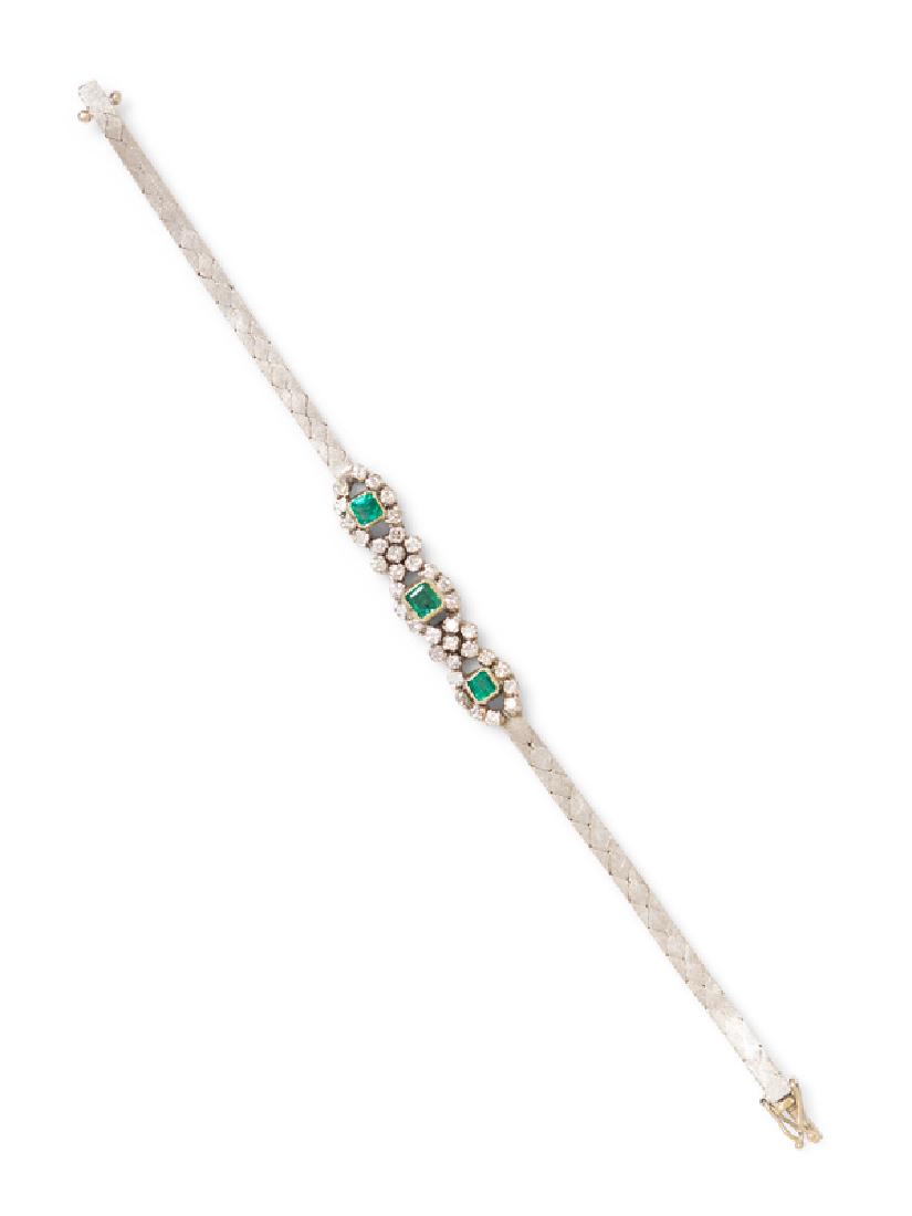 An 18 Karat White Gold, Emerald and Diamond Bracelet,: containing 3 square cut emeralds and 38 round brilliant cut diamonds weighing approximately 1.10 carats total.Â Stamp: 750.12.90 dwts.containing 3 square cut emeralds and 38 round brilliant cut diam