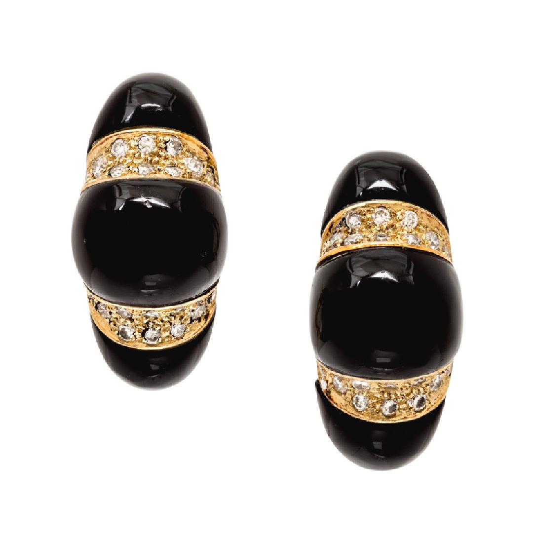 A Pair of 14 Karat Yellow Gold, Diamond and Onyx: containing 20 round brilliant cut diamonds weighing approximately 0.25 carat total and curved onyx sections. Stamp: 585 JJ. 11.90 dwts. Provenance: Property from a Private Collection Jackson, Wyoming