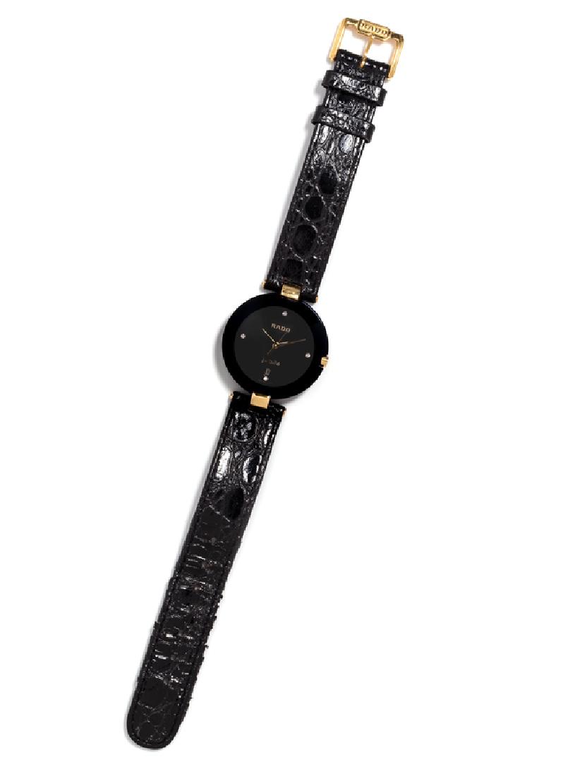 A Goldtone and Stainless Steel 'Jubile' Wristwatch,: 30.00 mm case diameter exclusive of lugs, black dial signed RADO, single cut diamond numeral markers at 3, 6, 9 and 12 o'clock, goldtone dauphine hands, snap on case back, squartz movement, black alli