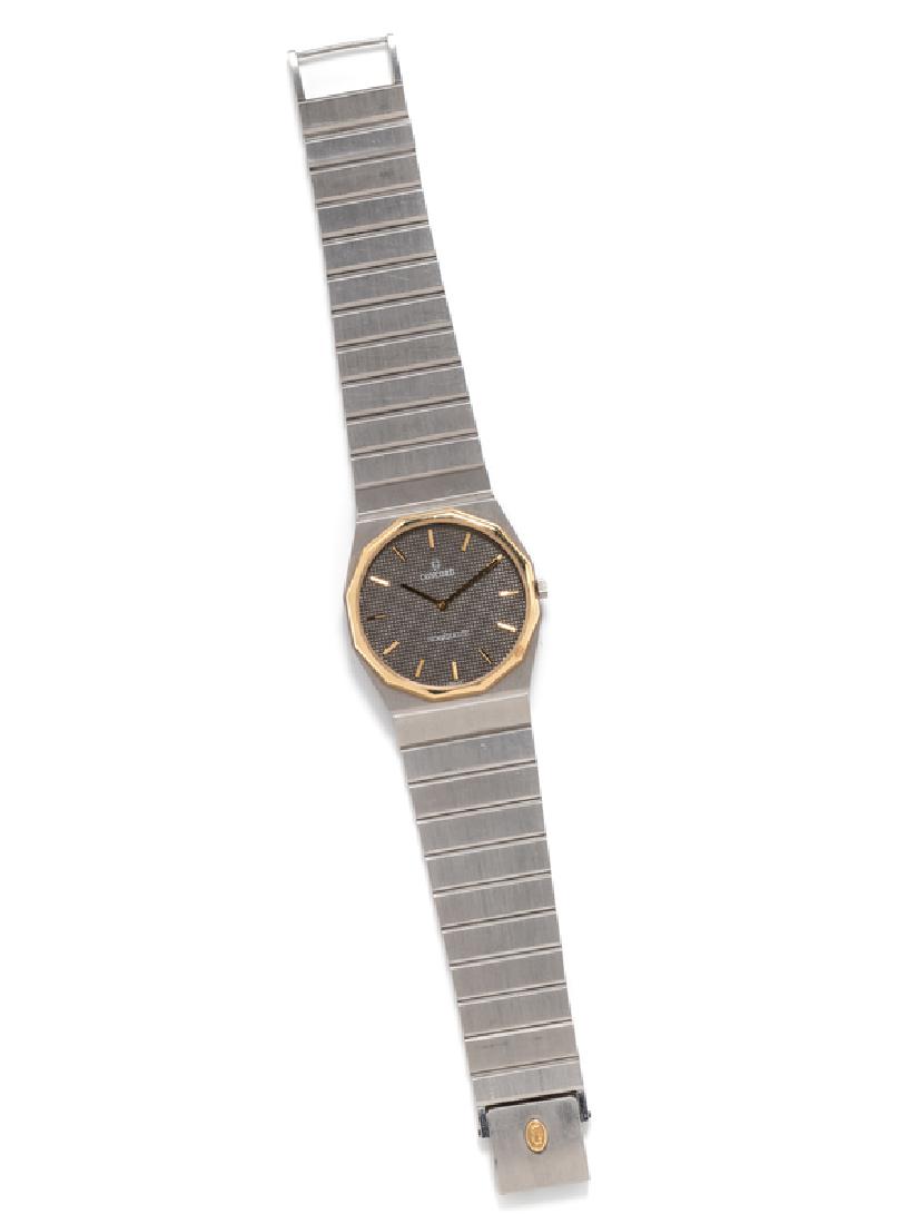 A Stainless Steel and 18 Karat Yellow Gold 'Mariner SG: 31.00 mm case diameter, gray 'Clois de Paris' textured dial signed CONCORD, applied gold baton numerals, gold baton hands, polished gold dodecagon bezel, snap on case back, quartz movement, integrated