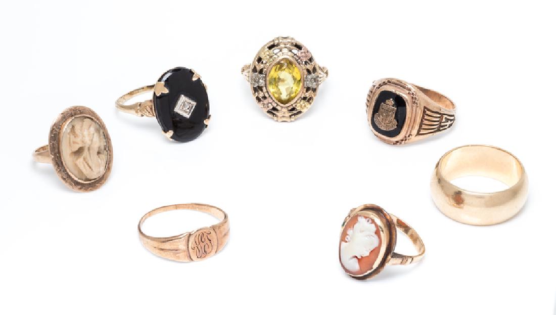A Collection of Yellow Gold and Gemstone Rings,: consisting of a 14 karat band, a 10 karat 1947 class ring, a 10 karat ring containing one oval shape onyx plaque and one mixed cut diamond, a 10 karat signet ring with engraved monogram, a yellow gold