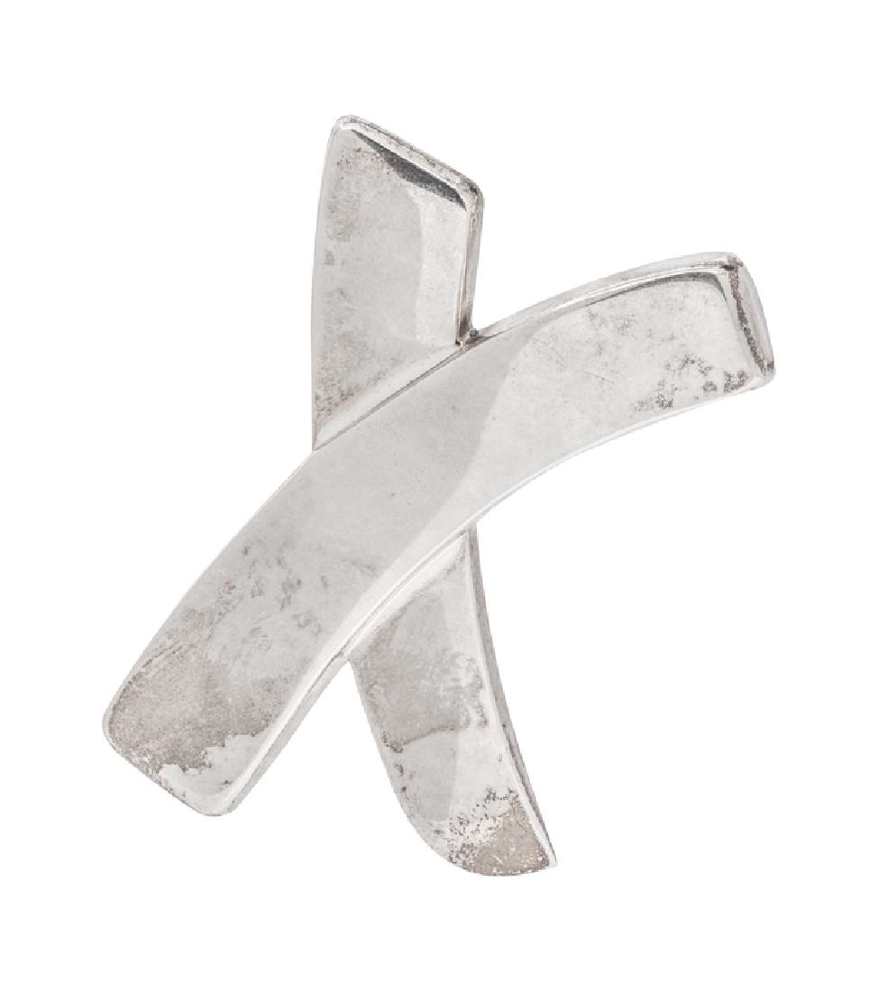 A Sterling Silver 'X' Brooch, Paloma Picasso for: designed as a swooping X. Stamp: Paloma Picasso TIFFANY & CO. 925. 15.55 dwts. Provenance: Property from a Private Estate, Highland Park, Illinois