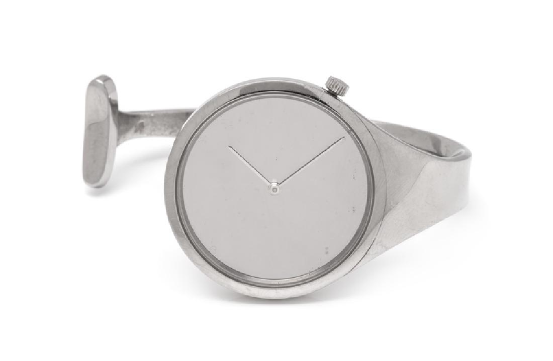 A Stainless Steel Bangle Wristwatch, Vivianna Torun: 33.00 mm case diameter, mirror dial, silvered index hands, polished bezel, case back affixed with four screws, quartz movement, solid steel open bangle bracelet. Case back stamp: GEORG JENSEN DENMARK 