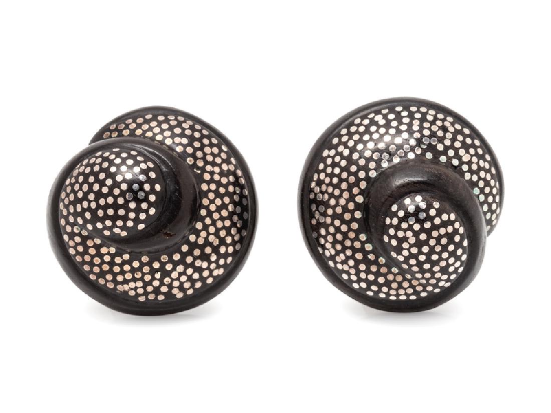 A Pair of Sterling Silver and Ebony Wood Earclips,: consisting of carved spiral ebony wood domes studded with sterling silver inlay. Engraved: Von Musulin 925. 23.00 dwts.