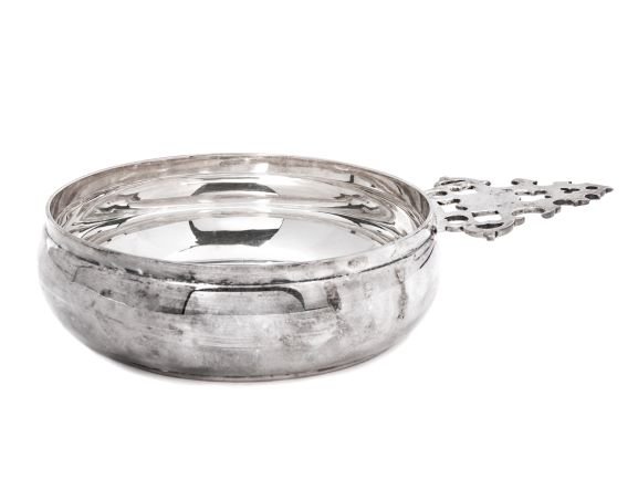 A French Silver Coney Style Porringer: A French Silver Coney Style Porringer Cartier, Paris, France, 20th Century a reproduction of a John Coney original marked on base Cartier Sterling X66 8 ozt 6 dwt Length 7 1/2 inches.