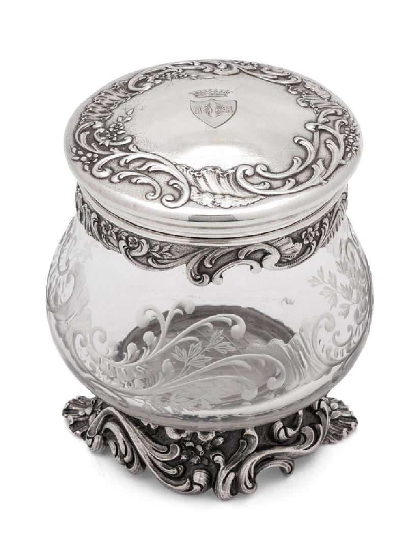 A French Silver Mounted Etched Glass Jar: A French Silver Mounted Etched Glass Jar FIRST QUARTER 20TH CENTURY by G. Keller, Paris; the lid having an engraved armorial. Height 5 1/4 x diameter 4 inches.