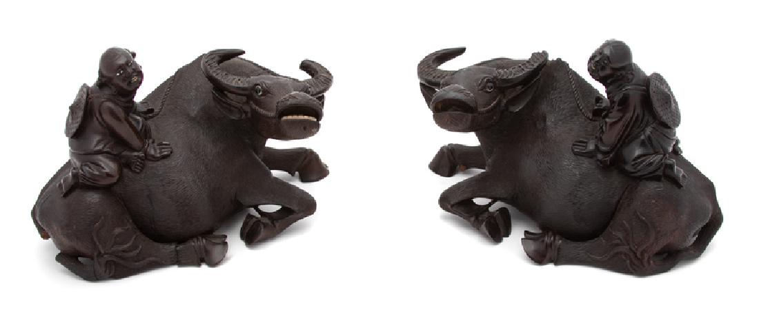 A Pair of Chinese Carved Wood Sculpture of a Boy Riding (1 of 1)