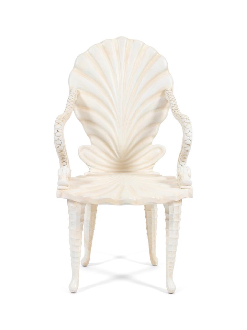A Grotto Style Carved and Painted Shell-Back Armchair: A Grotto Style Carved and Painted Shell-Back Open Armchair 20TH CENTURY with dolphin carved arms, seahorse carved legs. Height 38 1/4 inches.