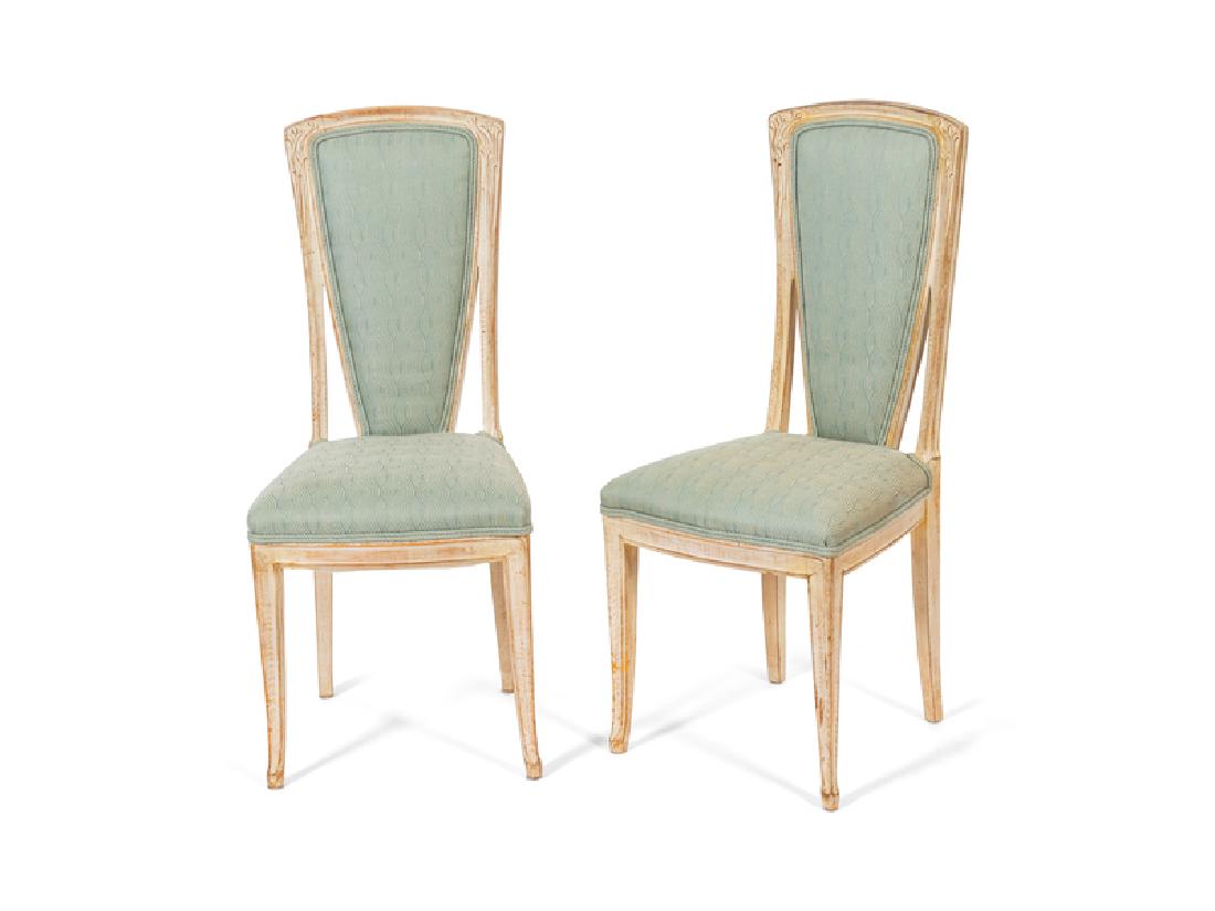 A Set of Six Art Nouveau Style Carved & Painted Chairs: A Set of Six Art Nouveau Style Carved and Painted Dining Chairs20TH CENTURYwith pale blue upholstered back rest and seat.Height 40 3/4 inches.