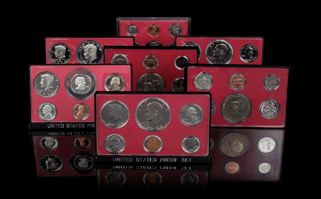 *A Collection of Seven United States Six-Coin Proof: *A Collection of Seven United States Six-Coin Proof Sets comprising 1973, 1974, 1975 (x2), 1978, 1979 and 1980 examples. Provenance: Property from the Estate of Rhoda Grebe, Parrish, FL