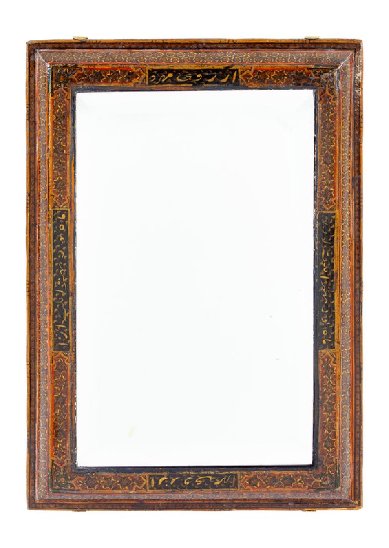 A Qajar Hand Carved and Lacquered Mirror 19TH: A Qajar Hand Carved and Lacquered Mirror 19TH CENTURY Height 22 x width 15 1/2 inches.