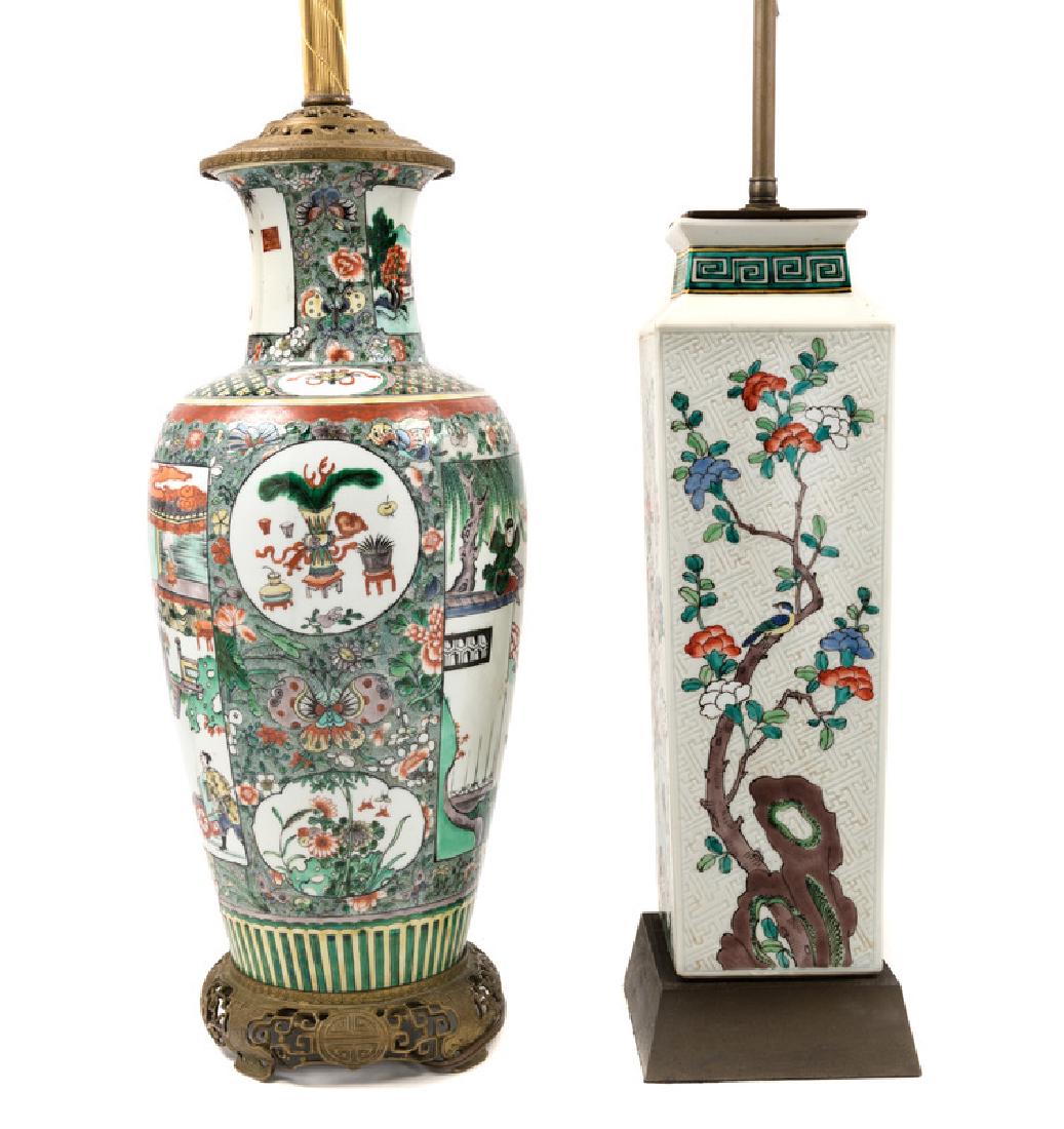 Two Chinese Famille Verte Porcelain Vases 19TH CENTURY: Two Chinese Famille Verte Porcelain Vases 19TH CENTURY the first a baluster example painted with reserves enclosing figures in interior scenes. the second a square example decorated with prunus branch