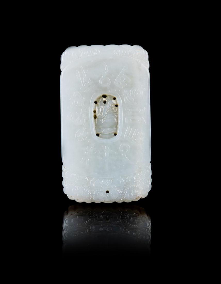 A Chinese White and Russet Jade Bi Disc 20TH CENTURY: A Chinese White and Russet Jade Bi Disc 20TH CENTURY carved to one side with a sinuous chilong encircling the center aperture, the other side in low relief with ruyi-heads. 6 diam centimeters,2 1/4 di