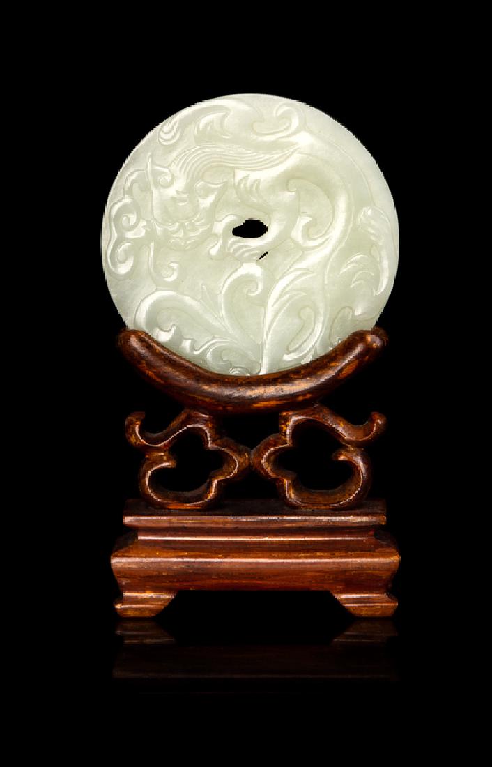 A Chinese White Jade Bi Disc 19TH CENTURY of circular (1 of 2)