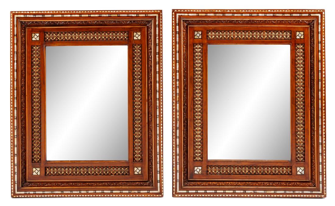 A Pair of Moorish Style Mother-of-Pearl Inlaid Mirrors: A Pair of Moorish Style Mother-of-Pearl Inlaid Mirrors Height 40 1/2 x width 33 inches.