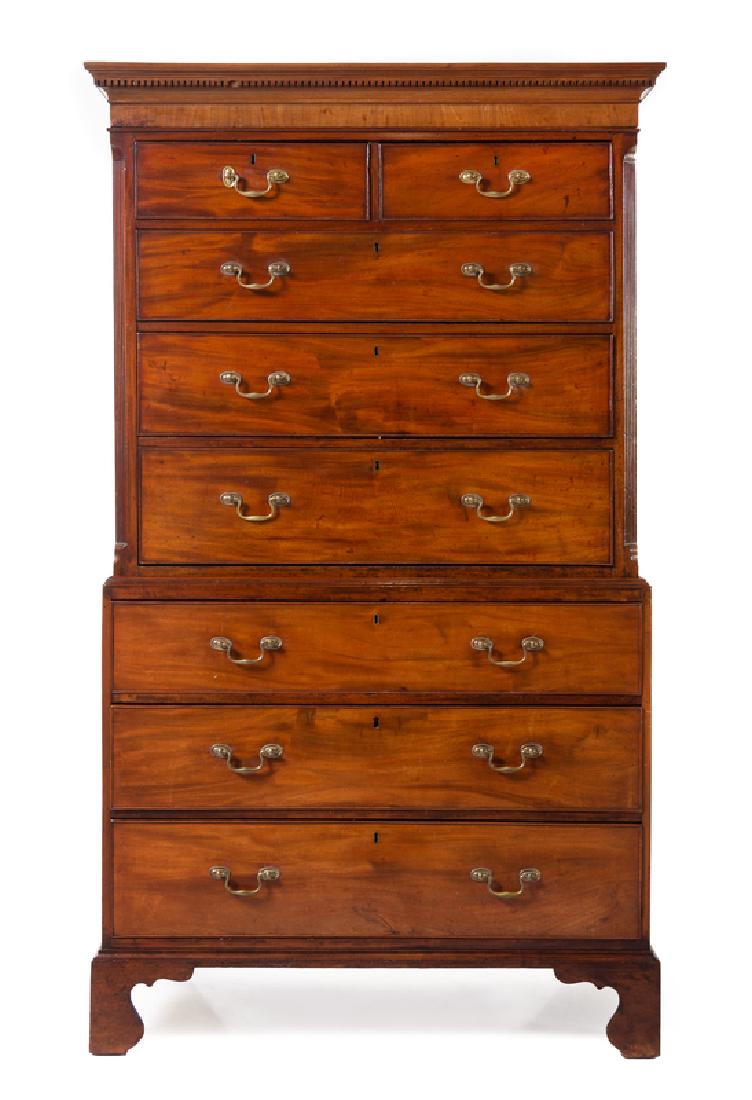 A George III Mahogany Chest on Chest: A George III Mahogany Chest on Chest Circa 1775 in two parts, the superstructure having a crest with dentiled decoration above two short drawers and three graduated long drawers, the base with three g